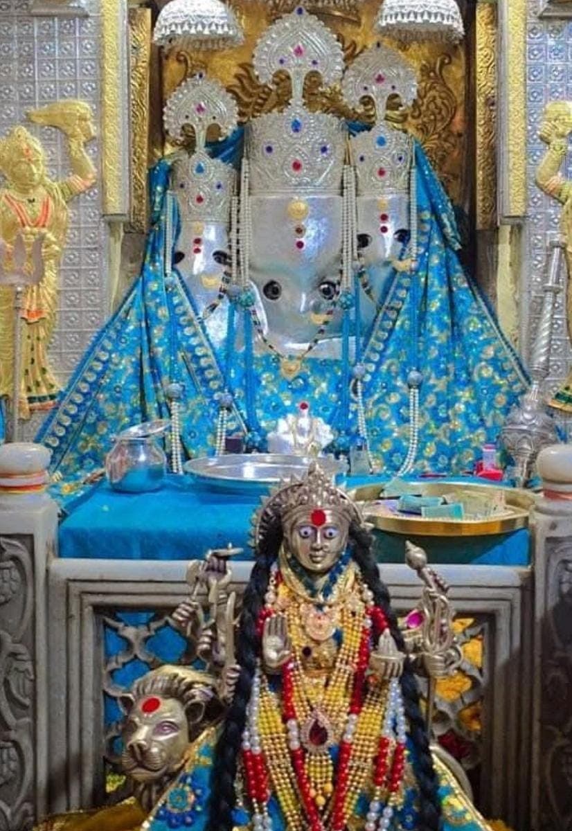 Priest holding a rudraksha mala